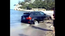 BMW X5 buried in Turkish beach sand