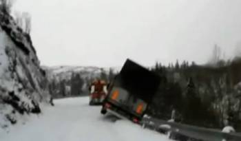 Semi-Trailer Drags Tow Truck Off Snowy Cliff