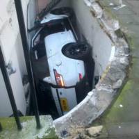 2014 Range Rover Sport ends up in front of a basement flat