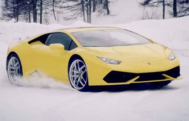 Lamborghini Huracan racing a snowmobile